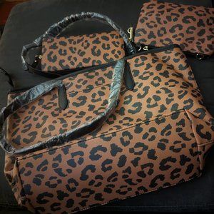 This is a Time and Tru Tote, Wristlet-Pouch Crossbody, and Zip-Around Wallet set